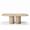Marble dining table with oval top and cylindrical base in beige color
